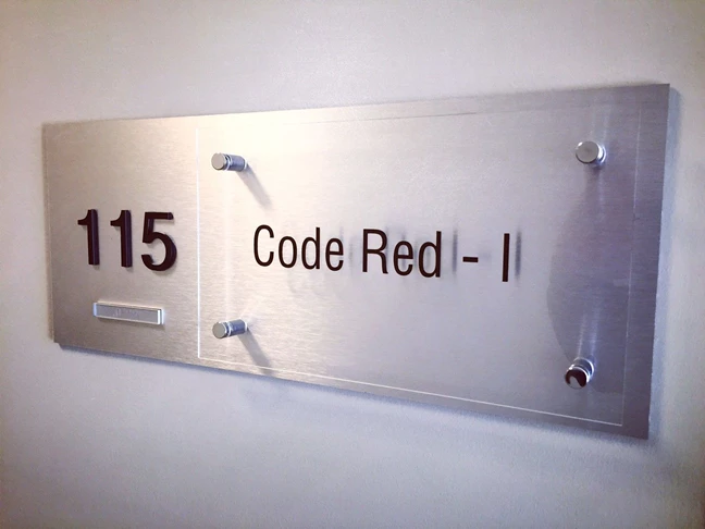 Custom Suite Plaque with Braille and Tactile Lettering